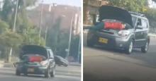 ¡Insólito! Video muestra a un hombre en Bogotá arreglando un carro en movimiento